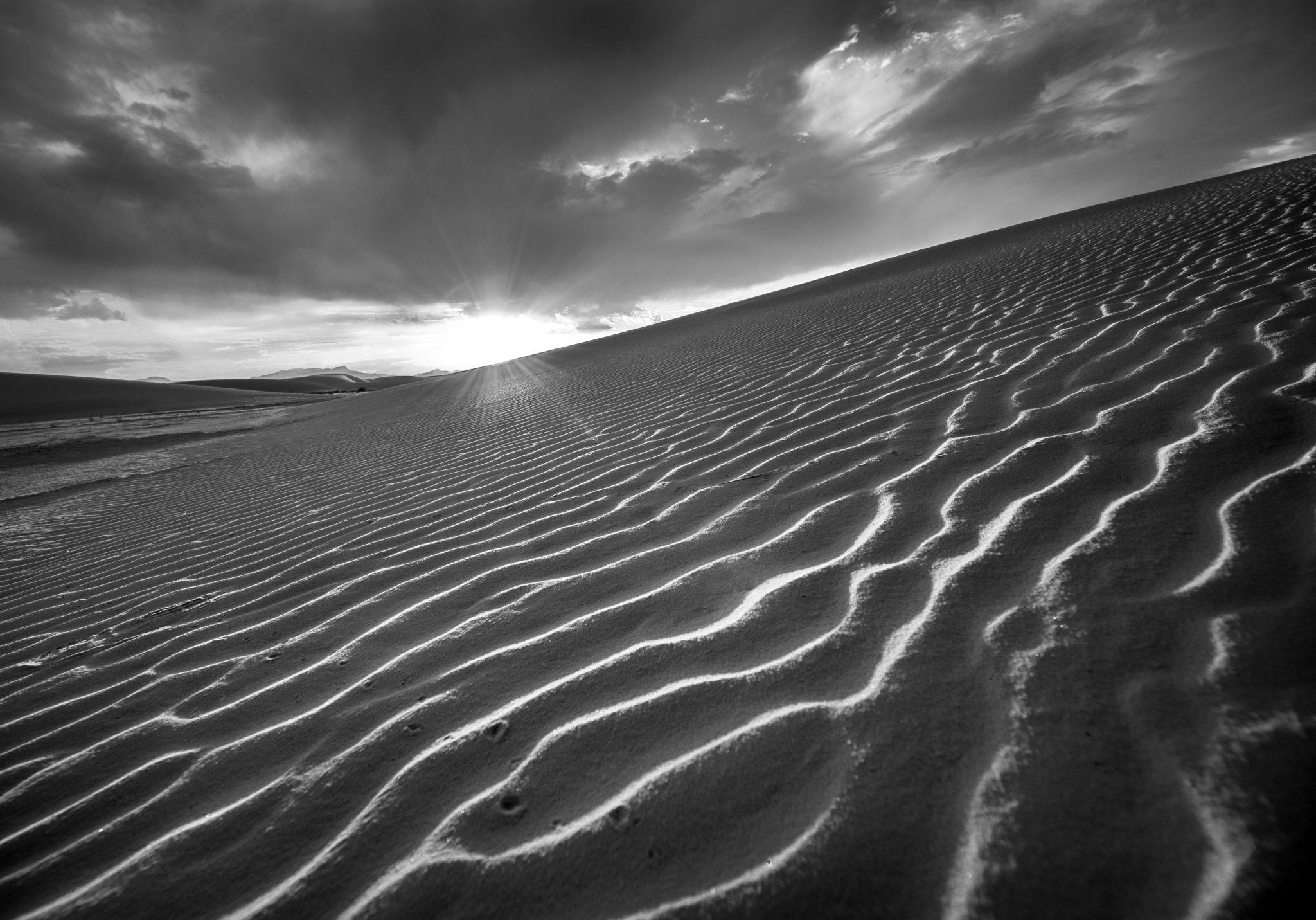 _ARS5187-Edit Black and white photo of a sand dune at dawn.